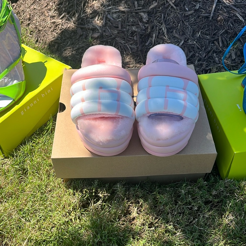 Stay cozy and stylish in these adorable pink and white UGG Platform Slippers